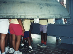 standing inside a huge bell